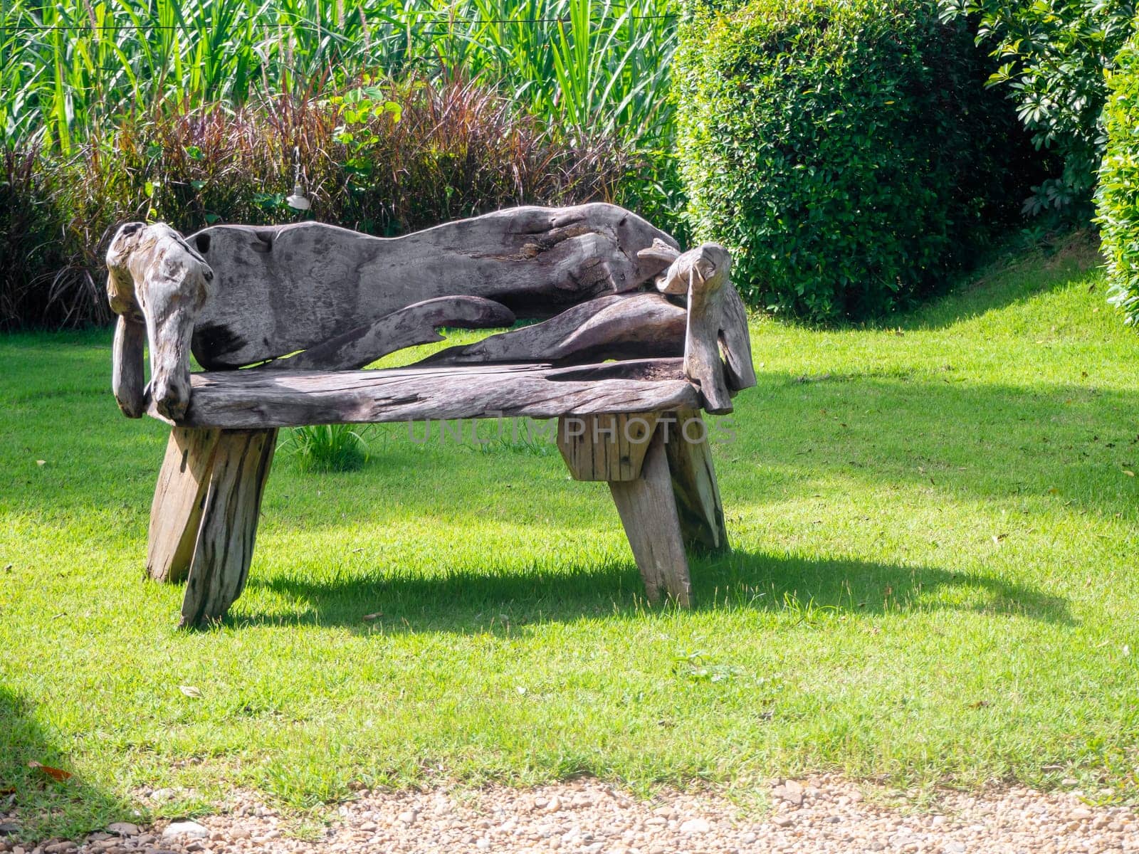 Old wooden table set  in the green garden.