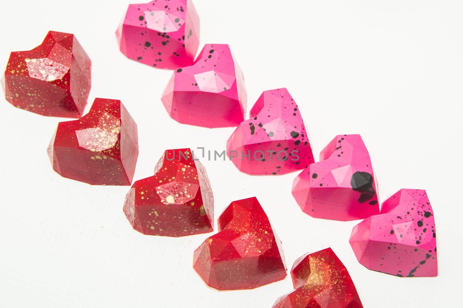 Delicious chocolate candies, close up, different colors.