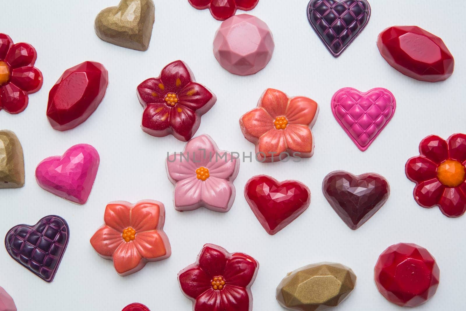 Delicious chocolate candies, close up, different colors.