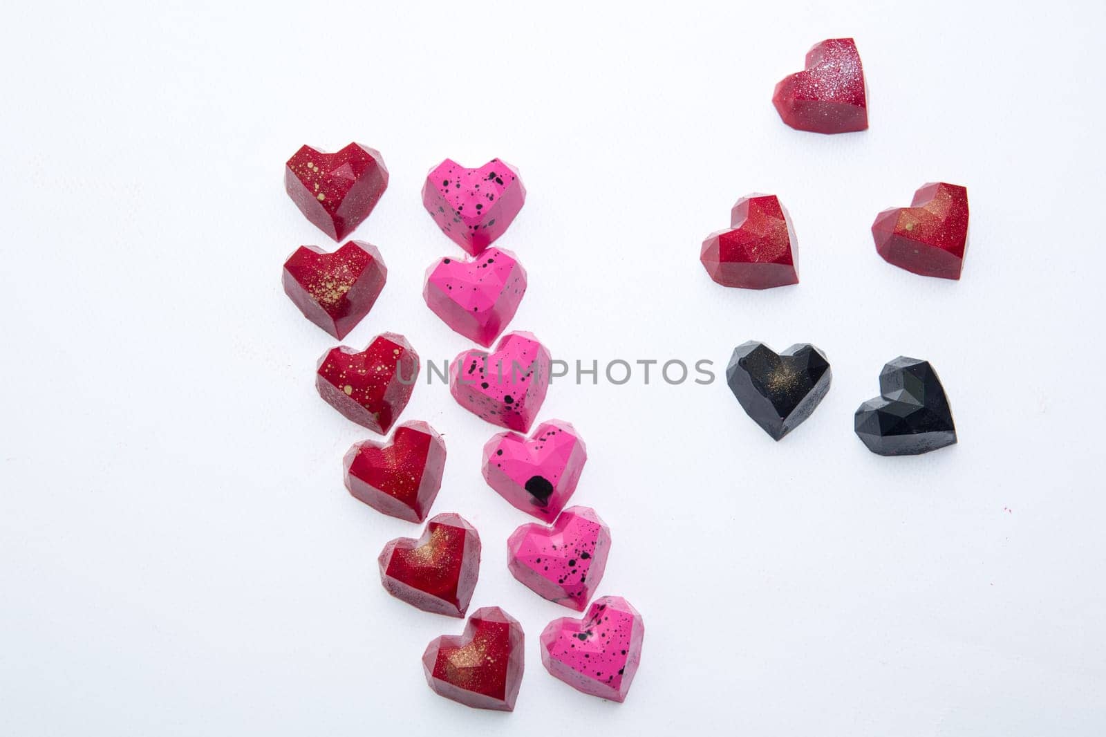 Delicious chocolate candies, close up, different colors.