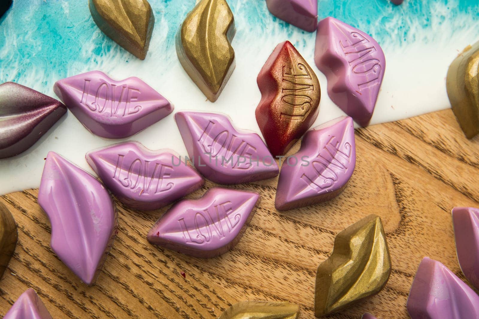 Delicious chocolate candies, close up, different colors.