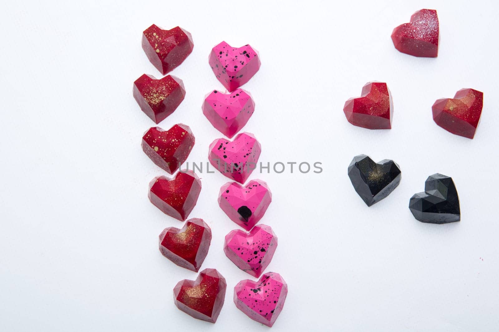 Delicious chocolate candies, close up, different colors.