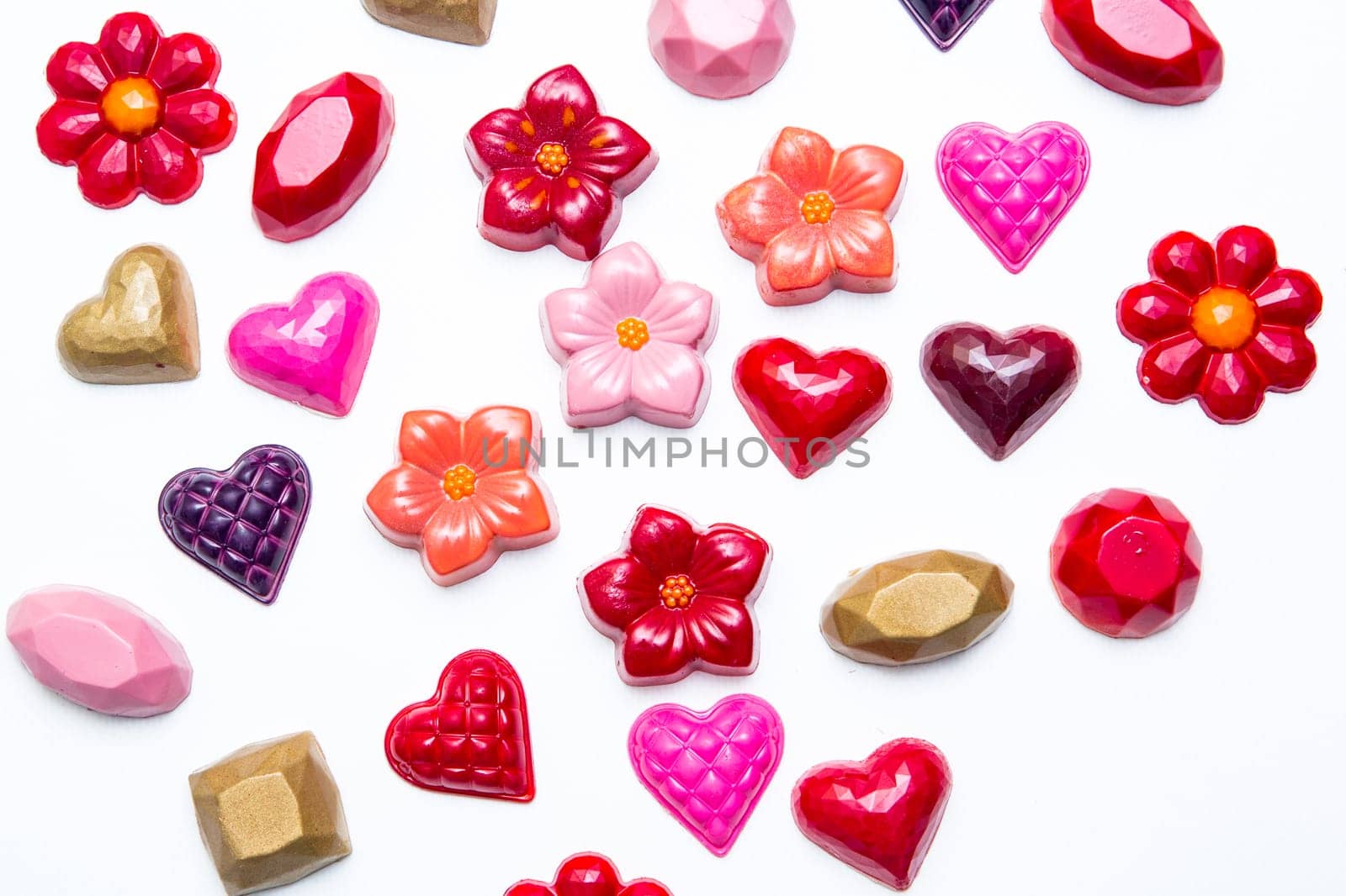 Delicious chocolate candies, close up, different colors.