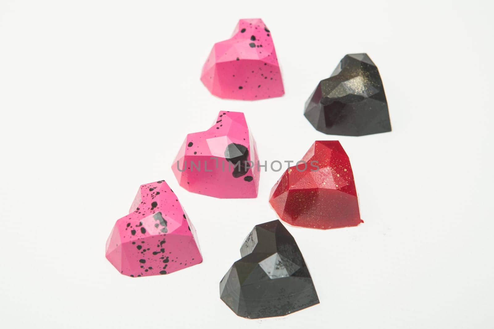 Delicious chocolate candies, close up, different colors.