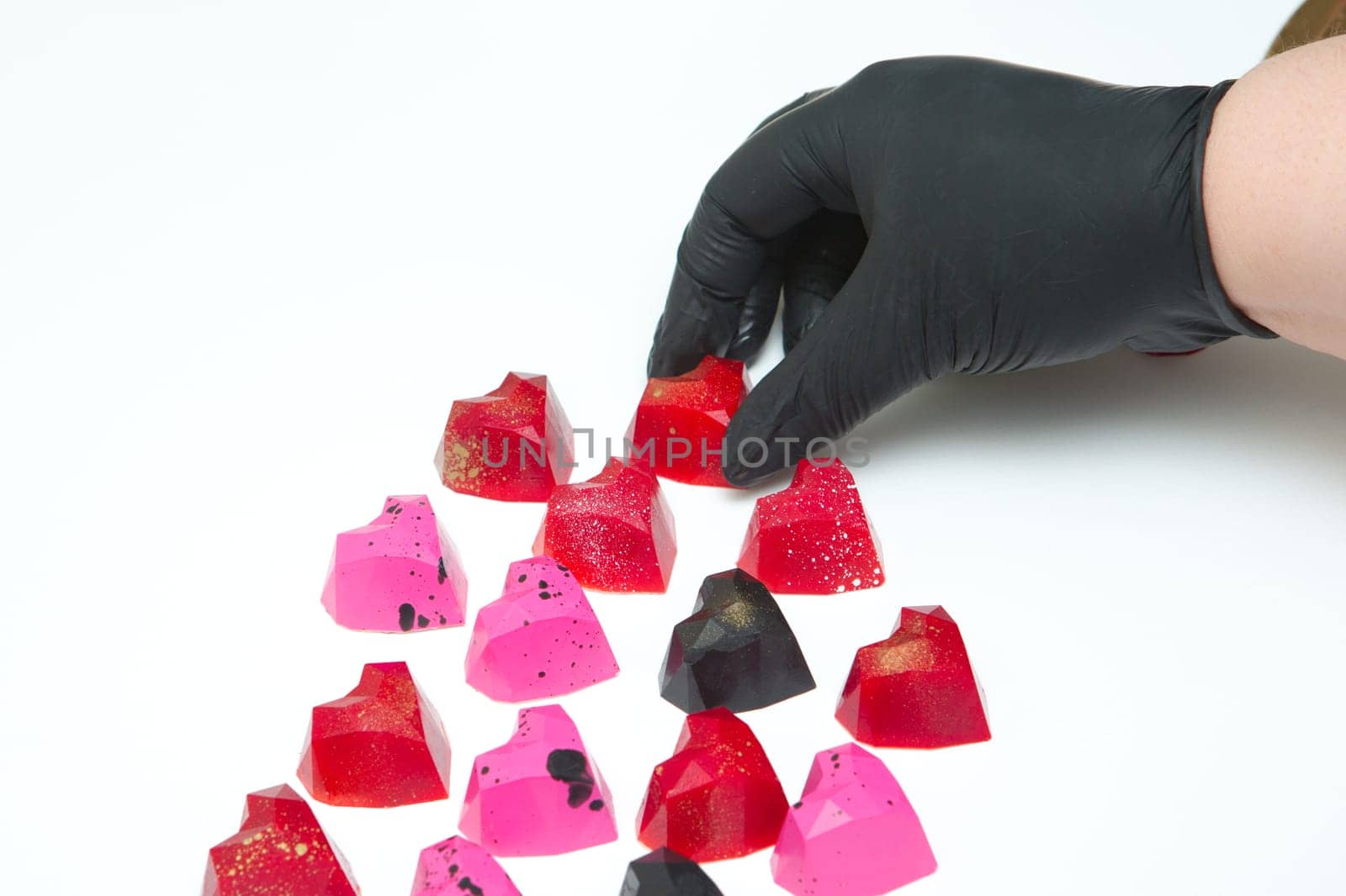 Delicious chocolate candies, close up, different colors.