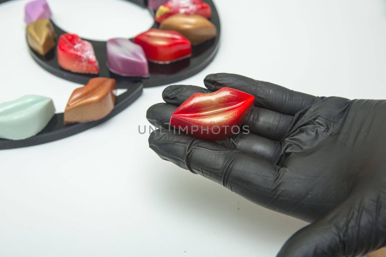 Delicious chocolate candies, close up, different colors.