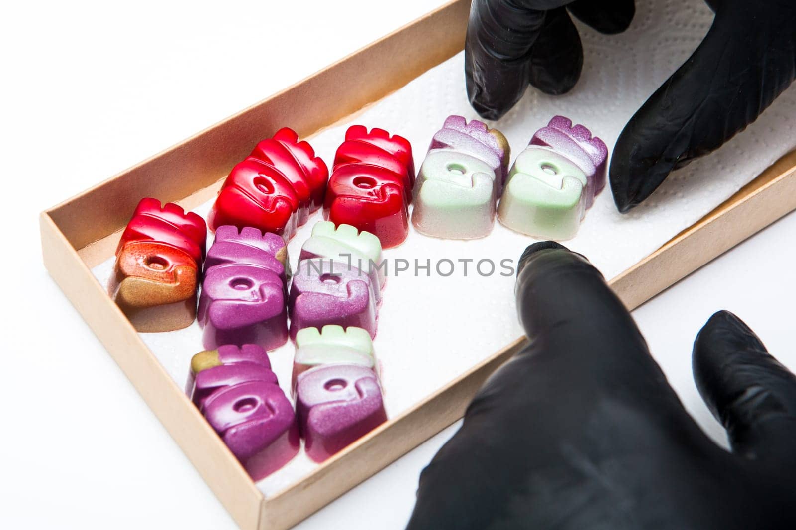Delicious chocolate candies, close up, different colors.