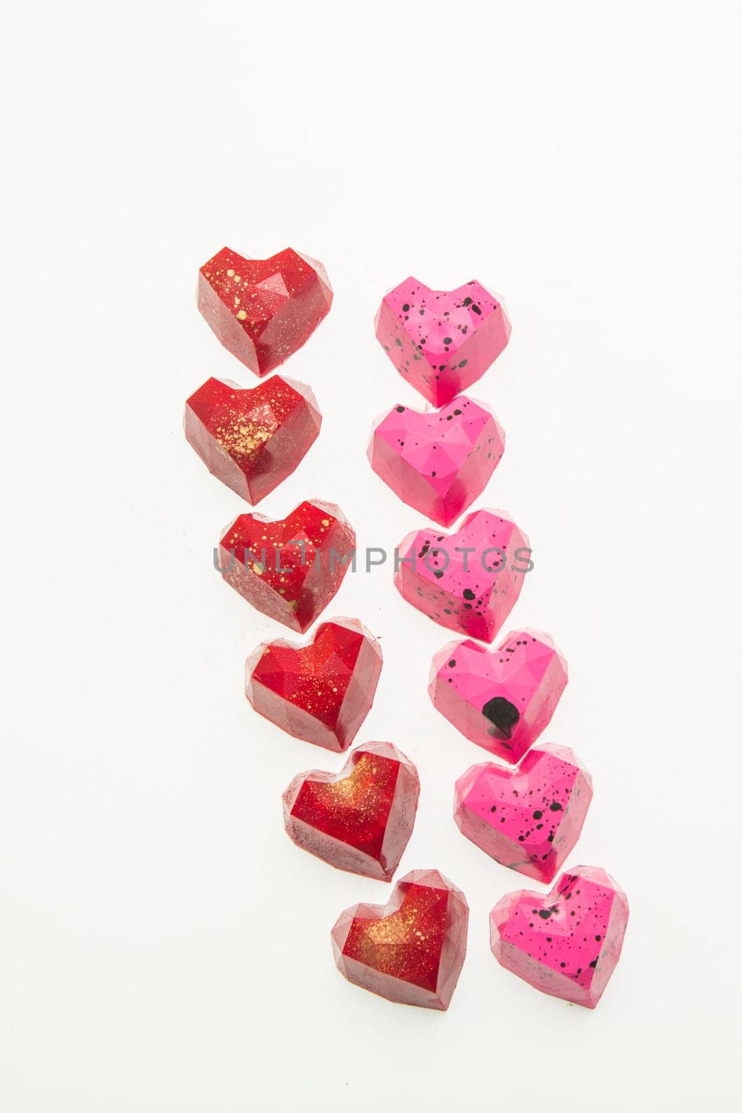 Delicious chocolate candies, close up, different colors.