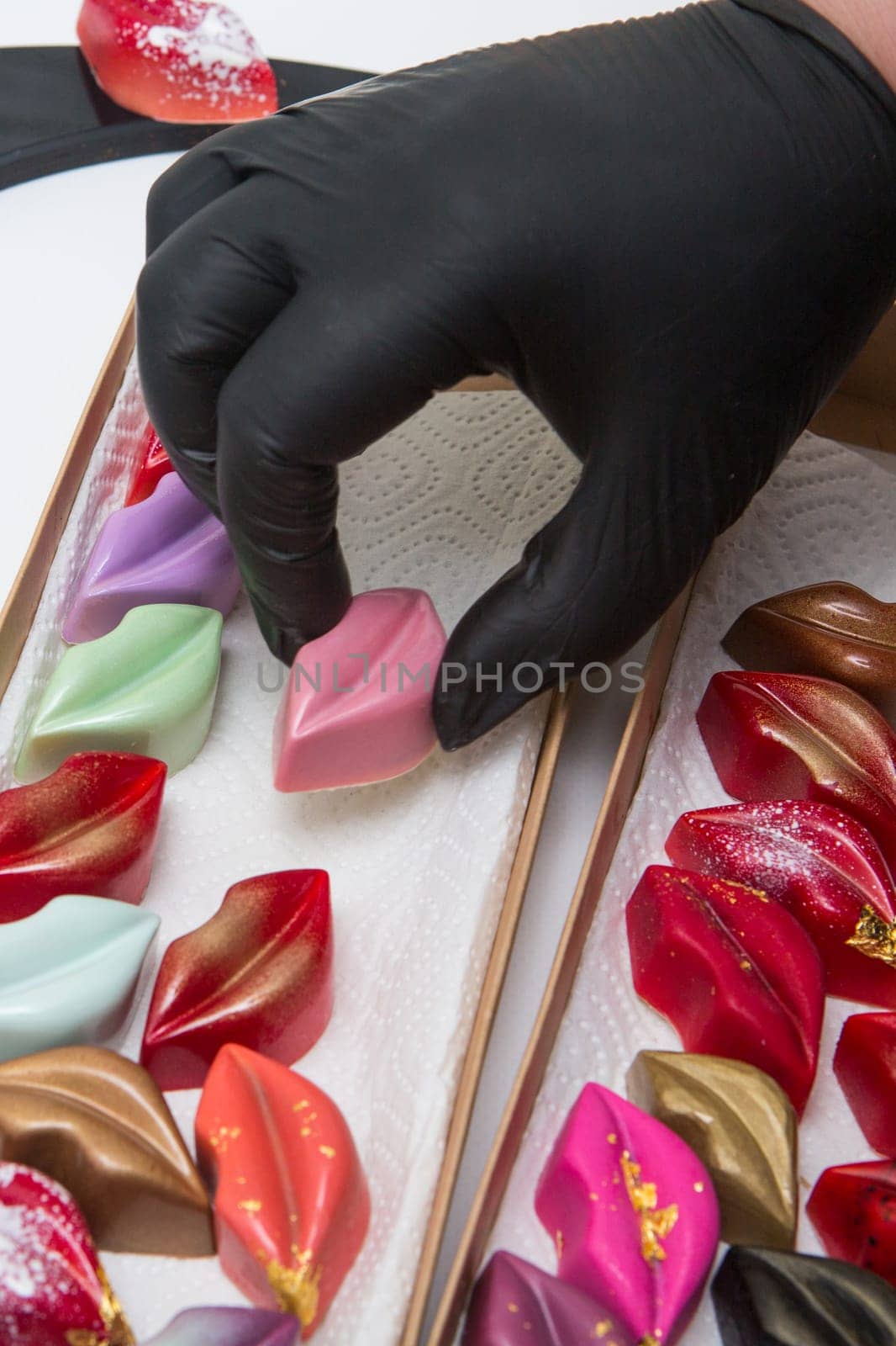 Delicious chocolate candies, close up, different colors.