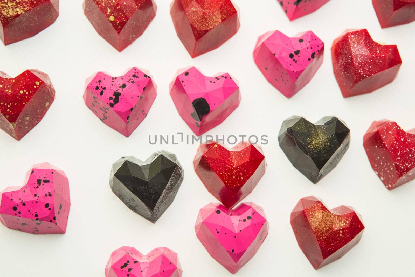 Delicious chocolate candies, close up, different colors.