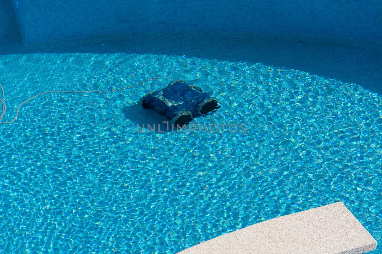 Automatic robot cleans the swimming pool underwater