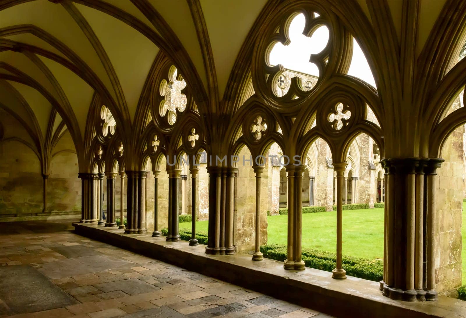 foreshortening of mullions and decoration of large cloister alongside famous Gothic church.