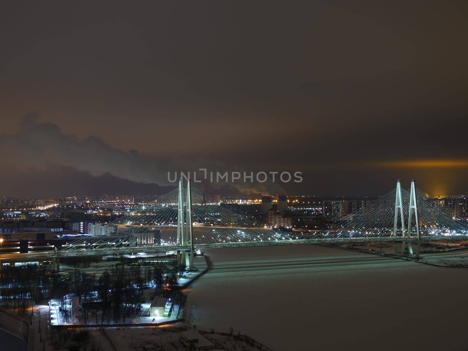 skyline St. Petersburg  illuminated at night, cable-stayed bridge in the foreground