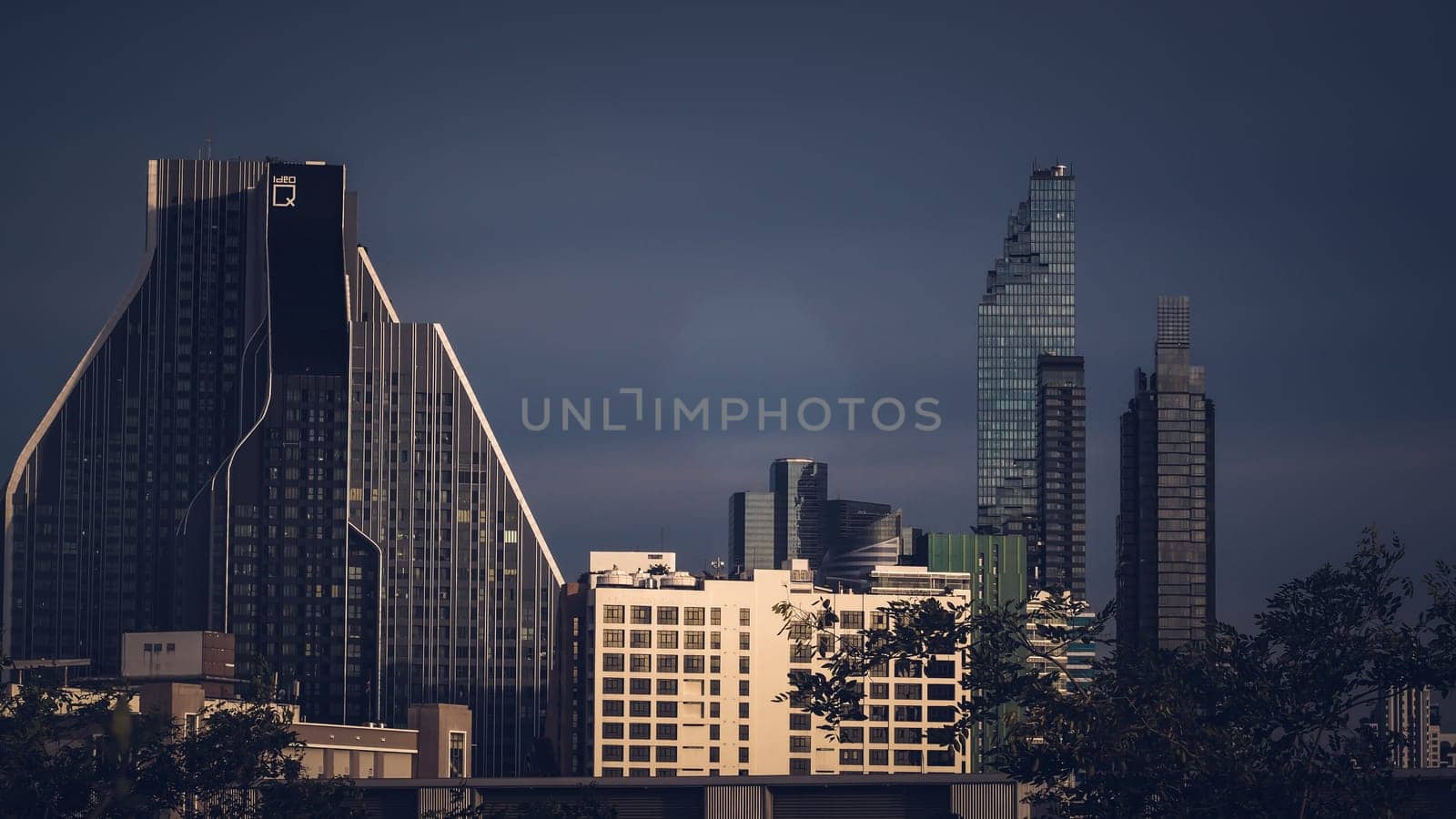 Aerial view of Bangkok modern office highrise buildings, condominium in Bangkok city downtown with sunset sky , Bangkok , Thailand