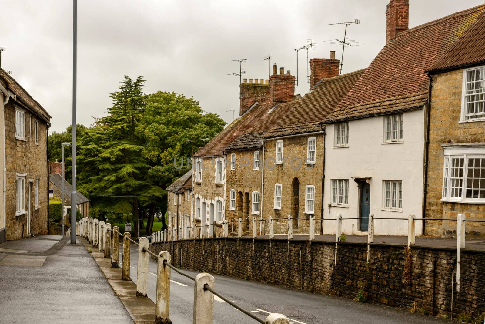 view of old houses  and downhill street in the historic village.
