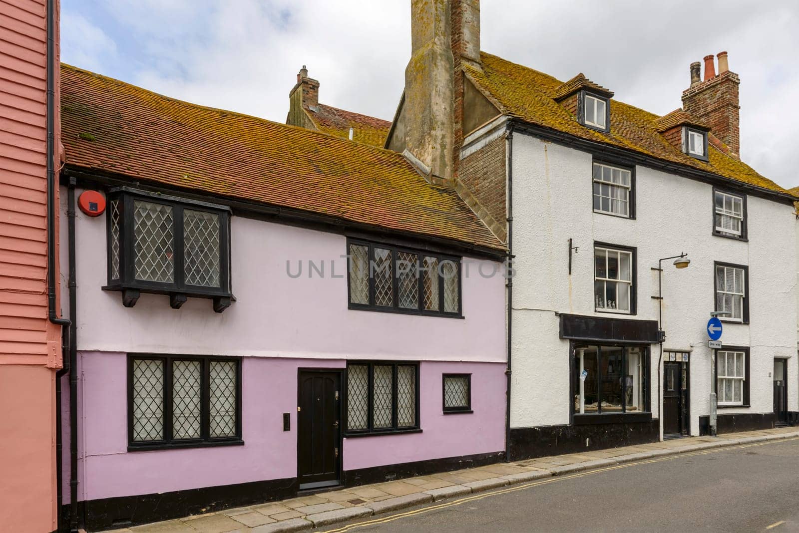 view of old houses on a street in the historic village of Hastings, East Sussex .