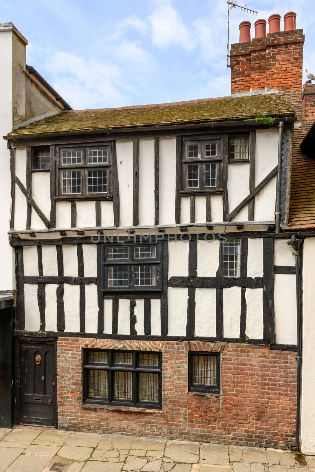 view of old wattle house on a street in the historic village of Hastings, East Sussex .