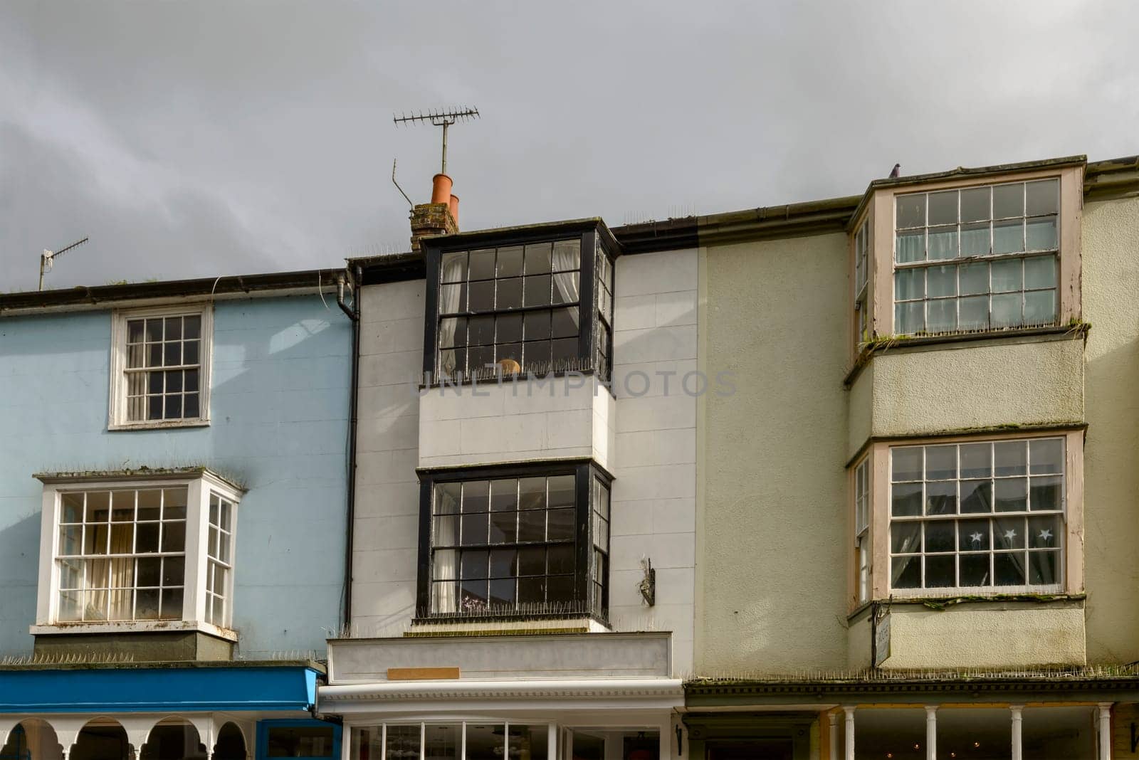 view of old bow windows on ancient houses in the historic village of Rye, East Sussex .