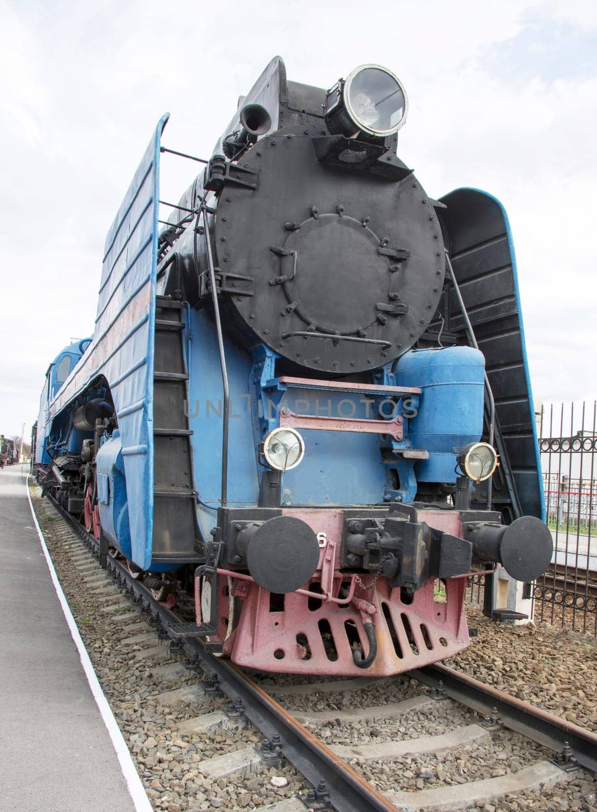 The blue express steam locomotive which is accelerating momentum 125 km/hour