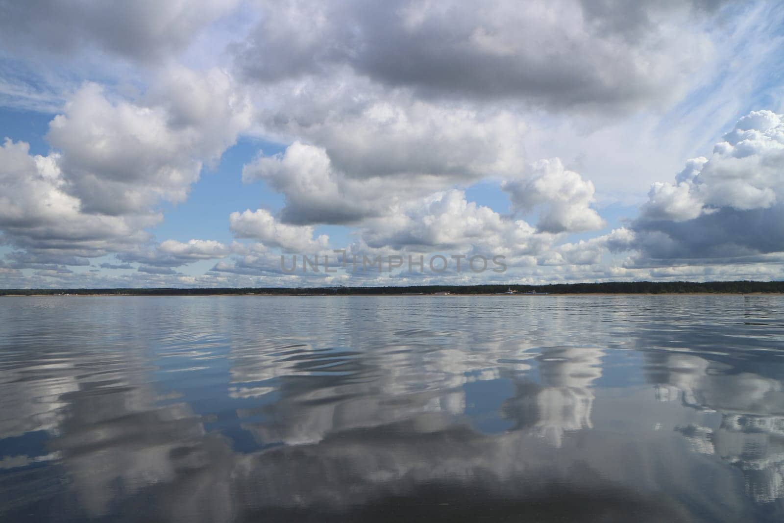 gorgeous cloudy landscape cumulus clouds are reflected in the water surface of the lake a soothing relaxing landscape