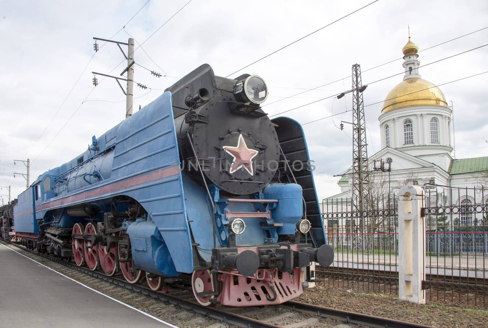 The blue express steam locomotive which is accelerating momentum 125 km/hour