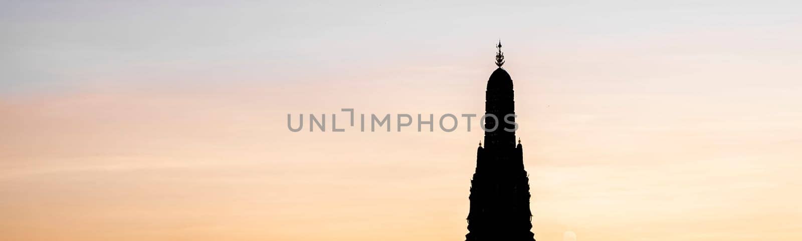 Sunset silhouette scene at Wat Arun Temple. The best place to watch sunset in Bangkok . Wat Arun Temple of the Dawn at sunset on banks of Chao Phraya River Bangkok Thailand Southeast Asia Asia