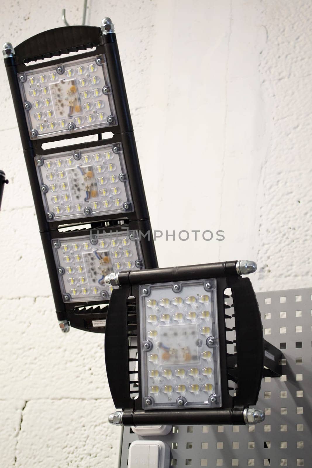 LED flood light, spot light on the top, exposition of industrial or street projectors close up