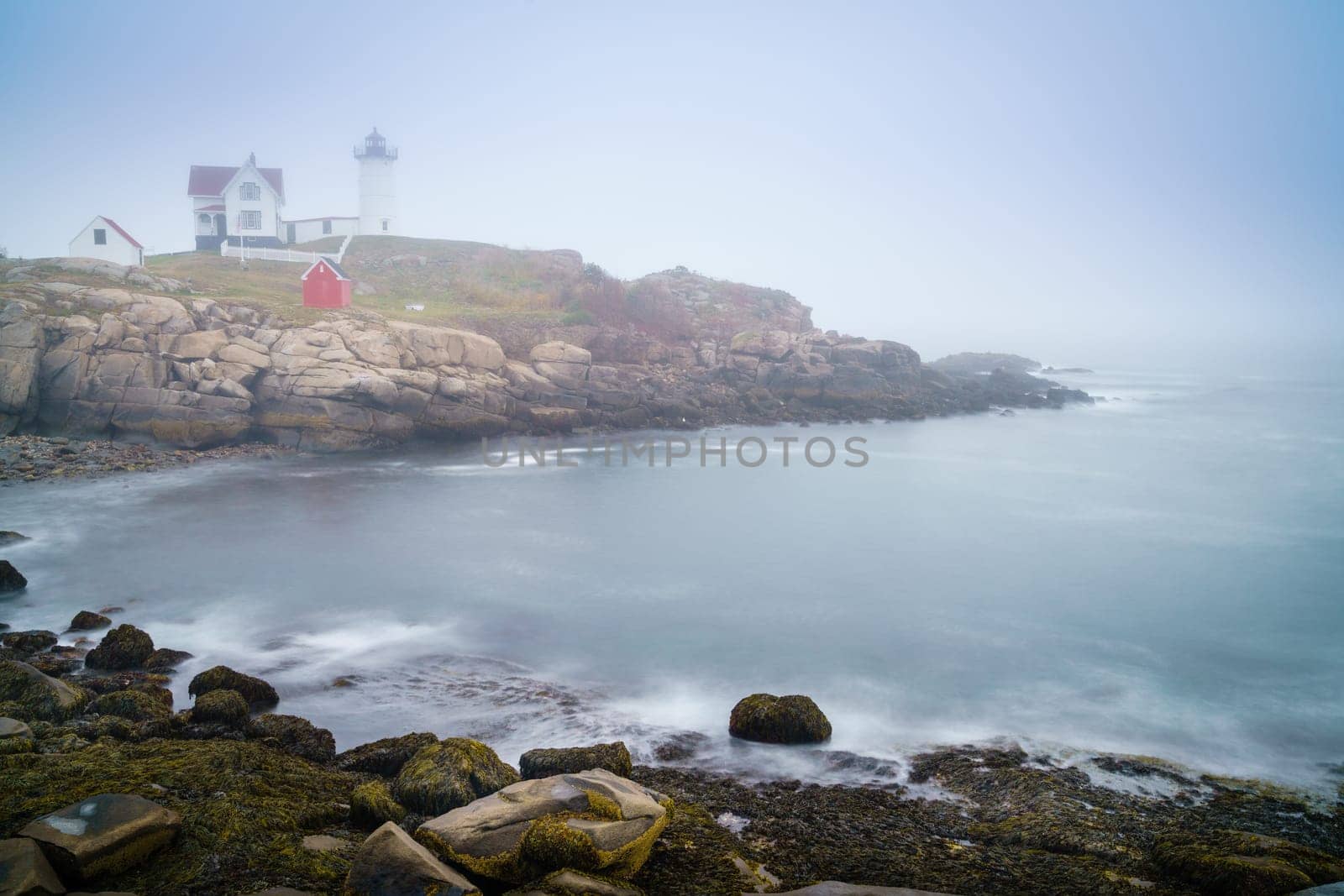 Long exposure image of Nubble lighthouse in York, ME in dense fog