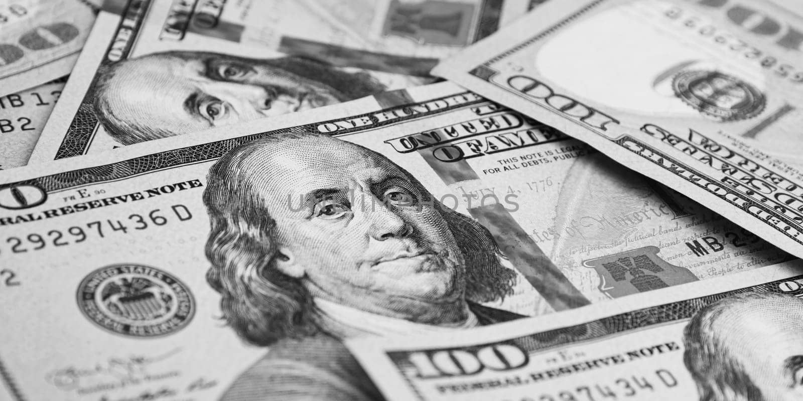 A hundred American banknotes are scattered. cash hundred-dollar bills, dollar background image.