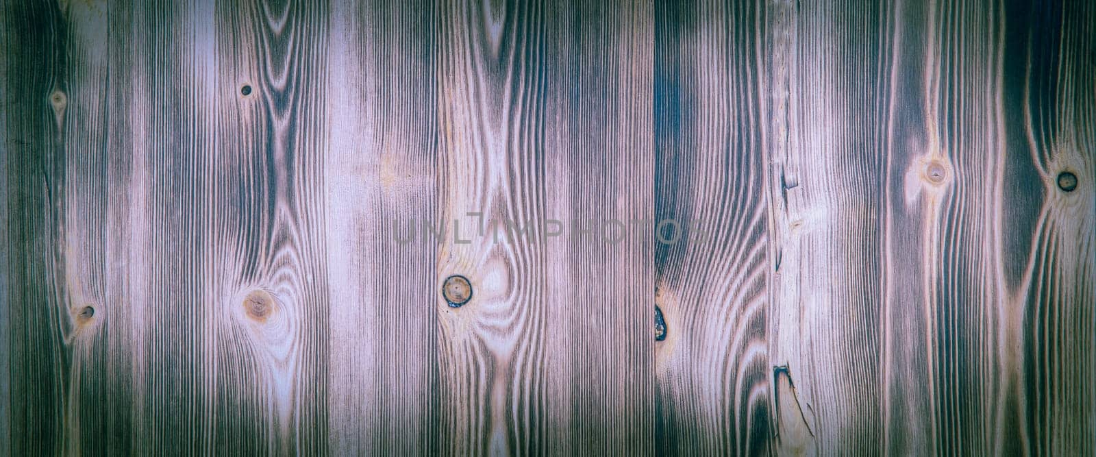 Old wooden background with purple horizontal boards. layout, space for text and logo.