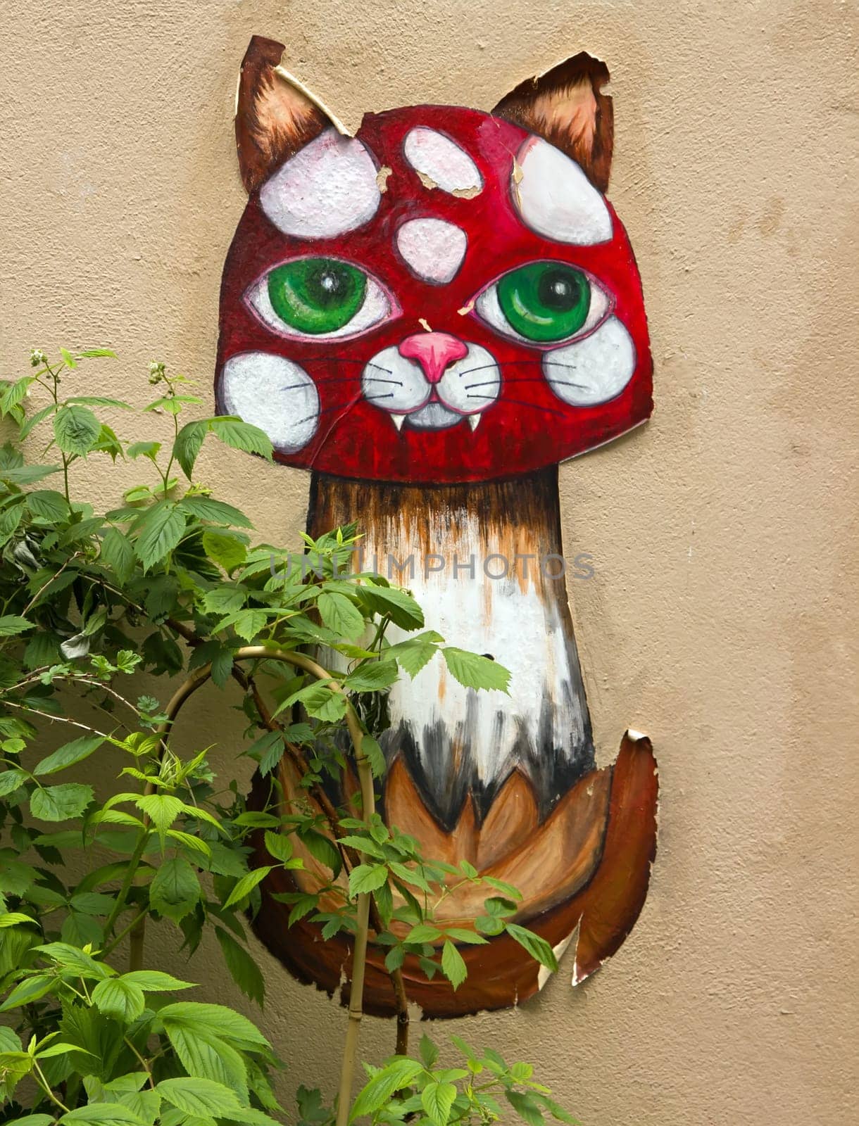 Cat collage street art in a street of Paris (France).