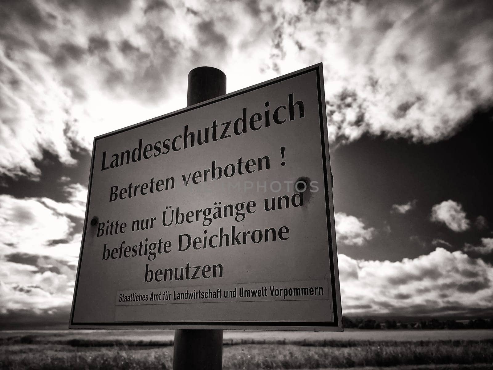 Warning sign on protective dike, Mecklenburg Baltic Sea coast