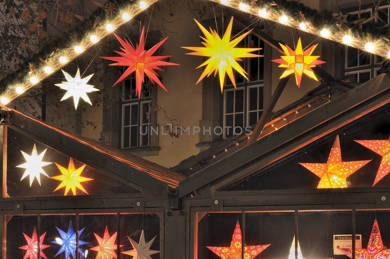 detail, at night, of traditional Christmas market held every Advent in streets and squares of city center ..