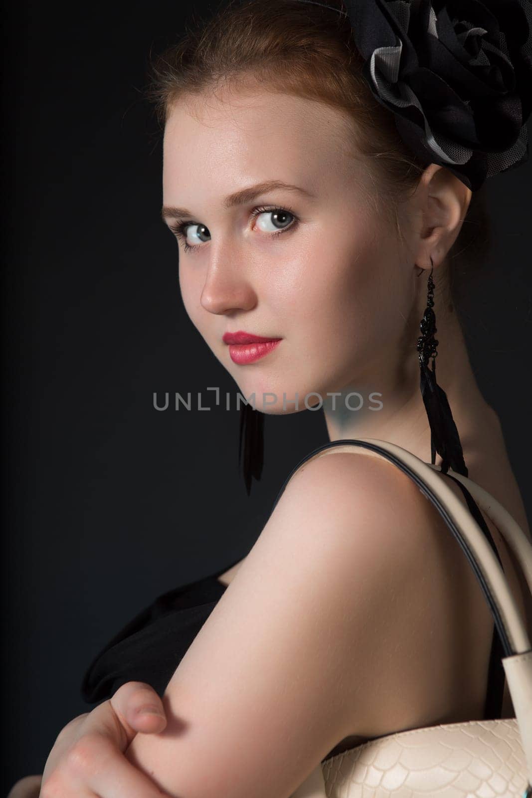 Pretty young woman with big white bag standing posing