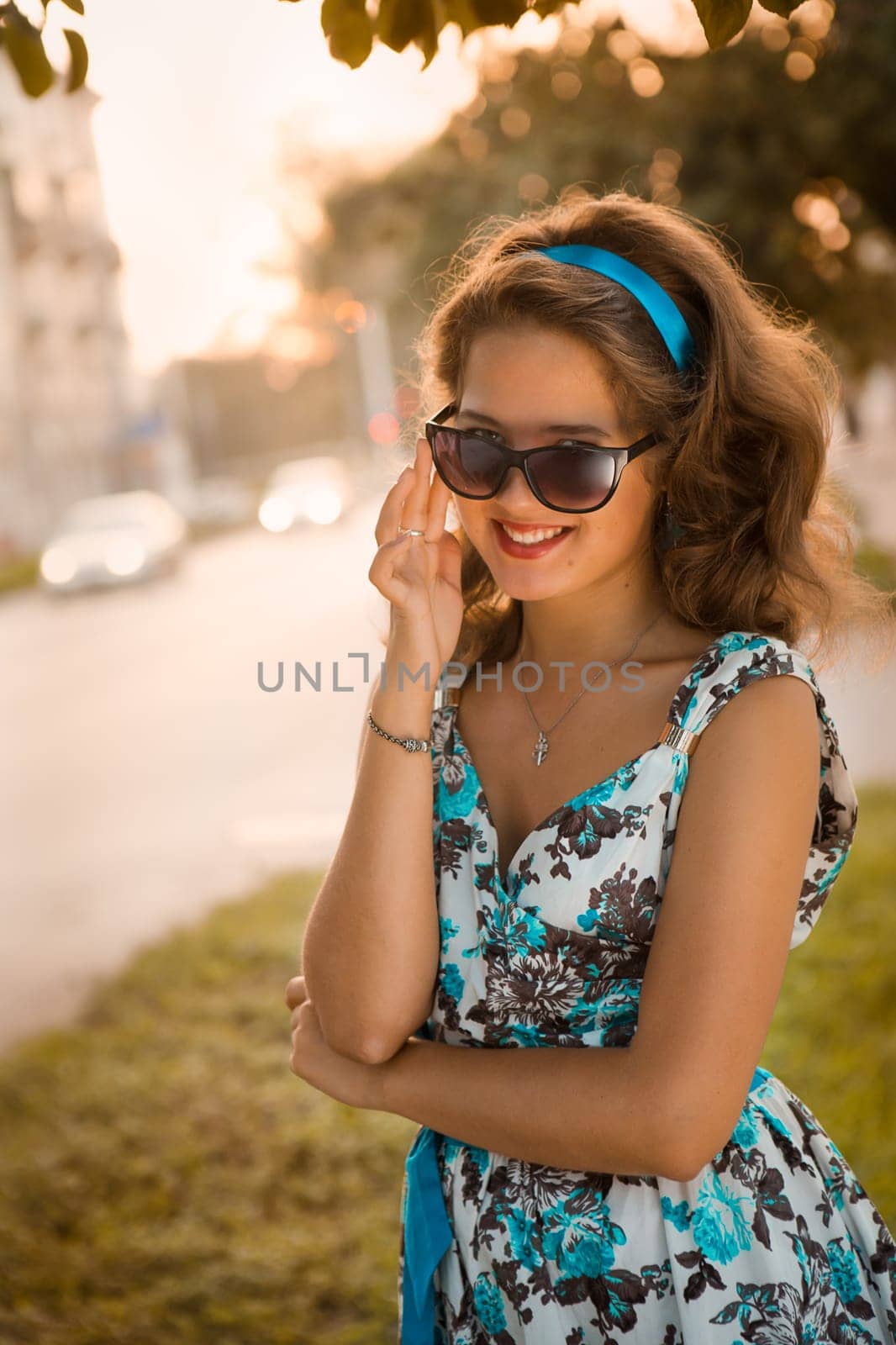 American redhead girl in suglasses. Photo in 60s style.