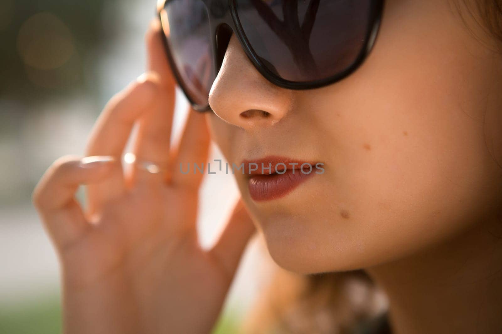 American redhead girl in suglasses. Photo in 60s style.