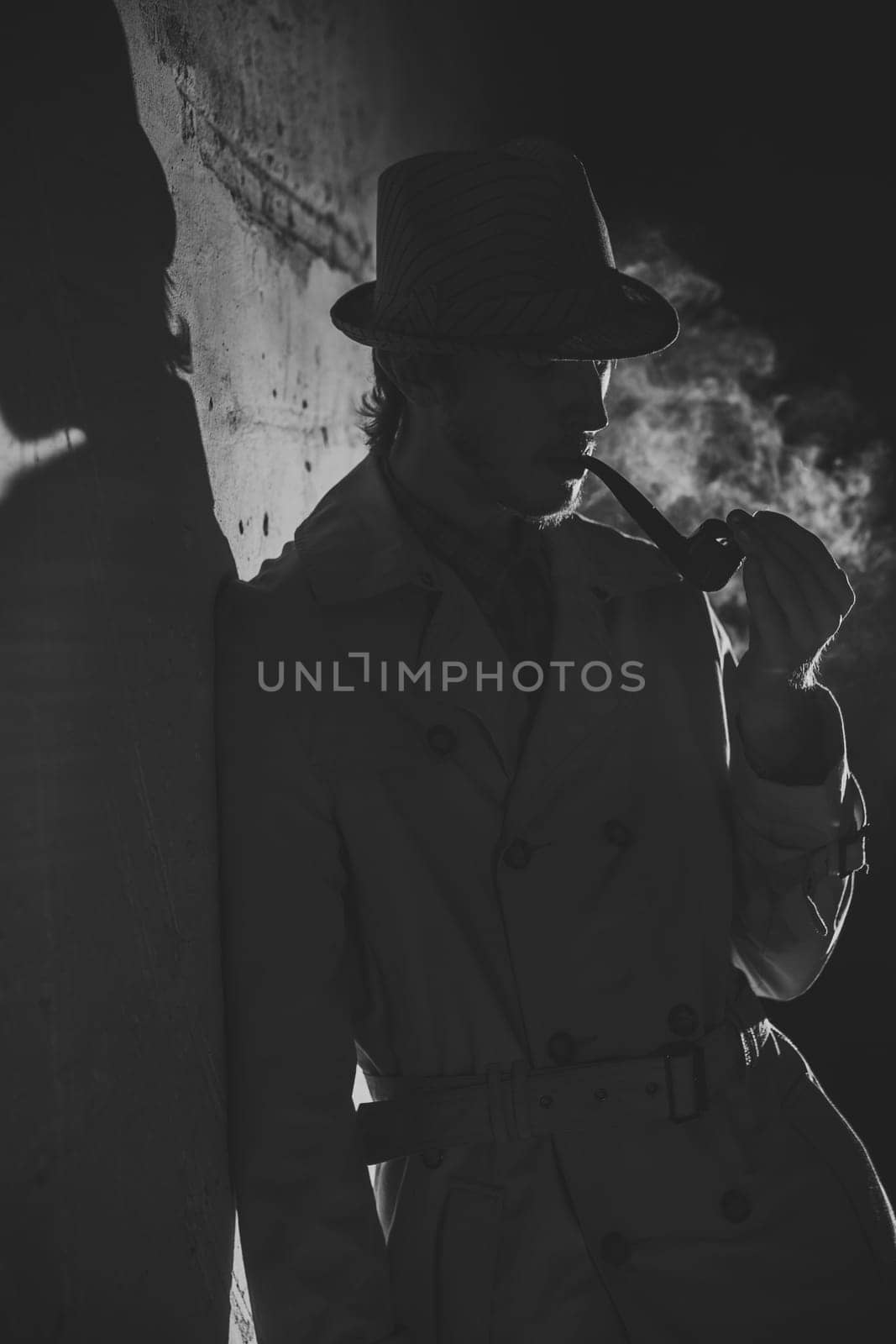 Black and white old-fashioned portrait of man with cigar