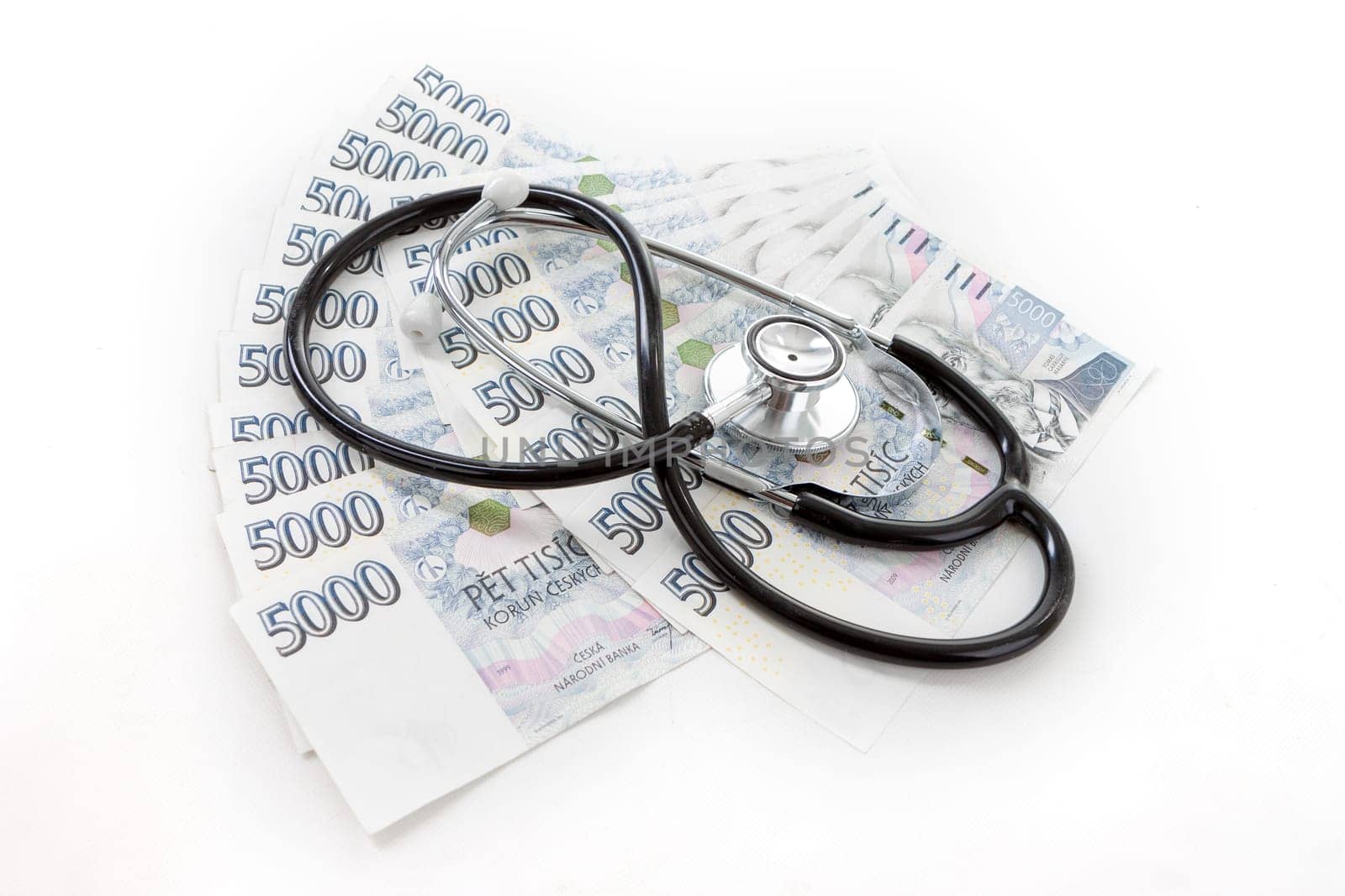 Czech paper money with heart on white background - stethoscope, heart, czech money 5000 and 1000