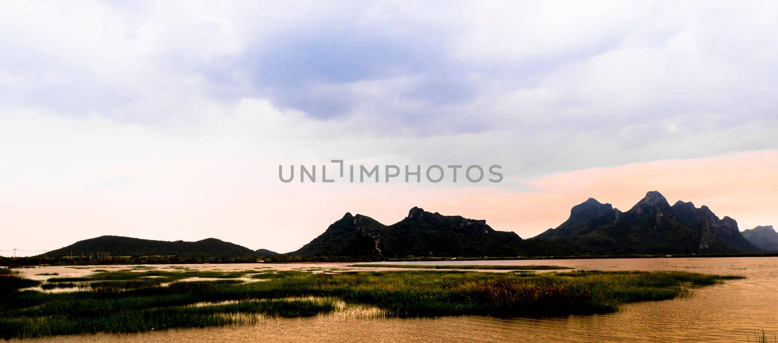 Mountain landscape, lake and mountain range, large panorama at sunset beautiful scenatic ,Prachubkeereekhan Khao Samroi yod  Thailand