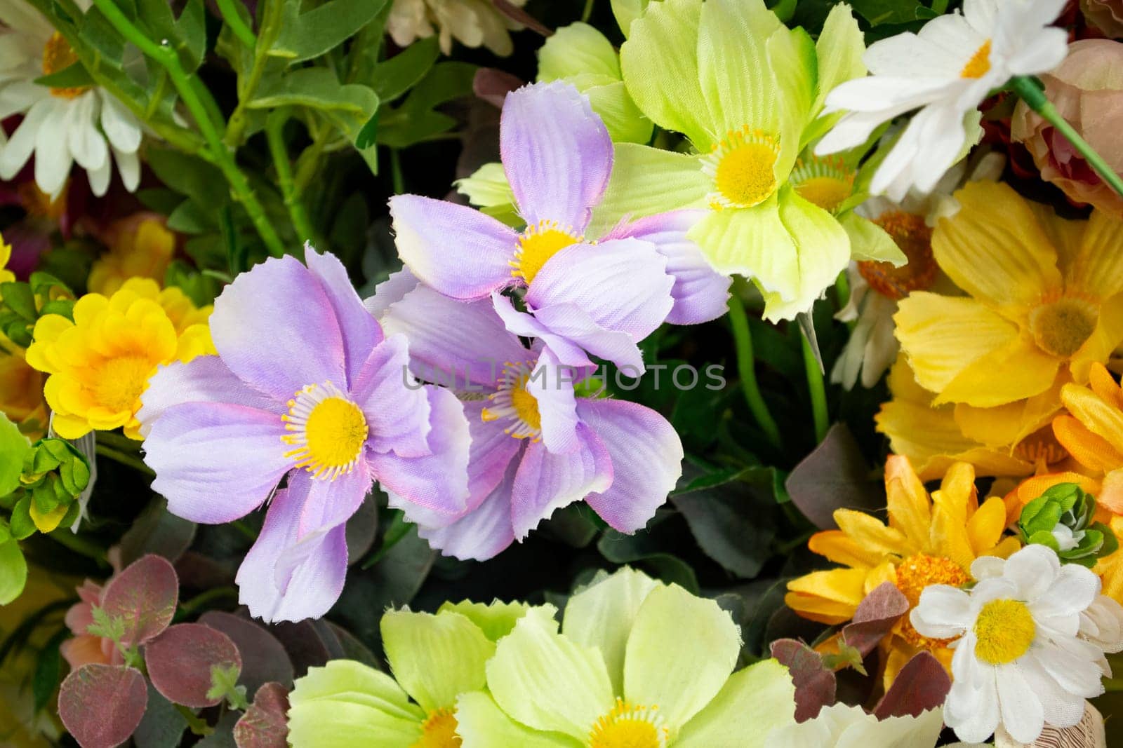 Retro artificial flowers bouquet, fake cloth flowers close up
