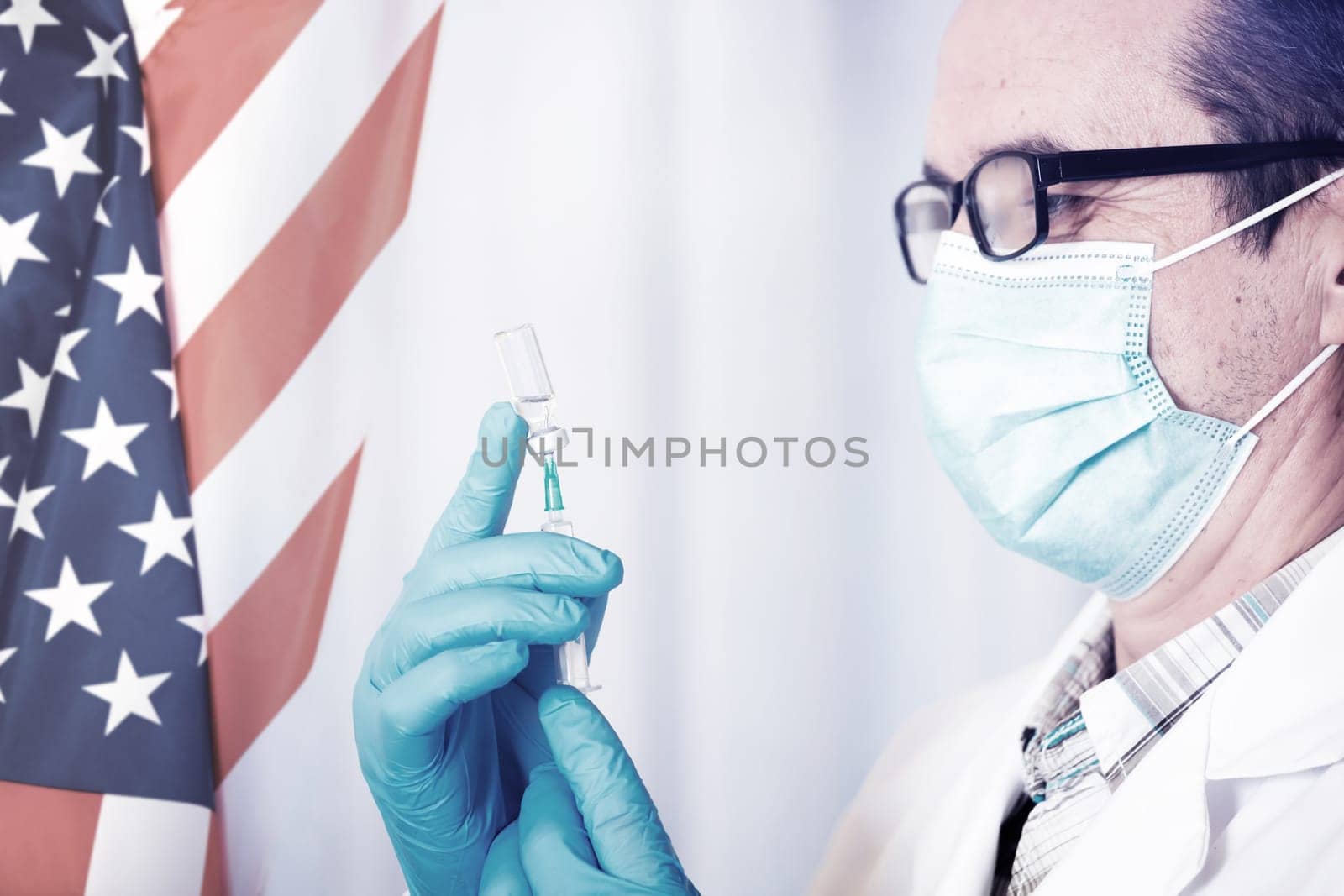 USA flag with doctor preparing for vaccine. Mass vaccination against the epidemic of coronavirus in USA  concept.