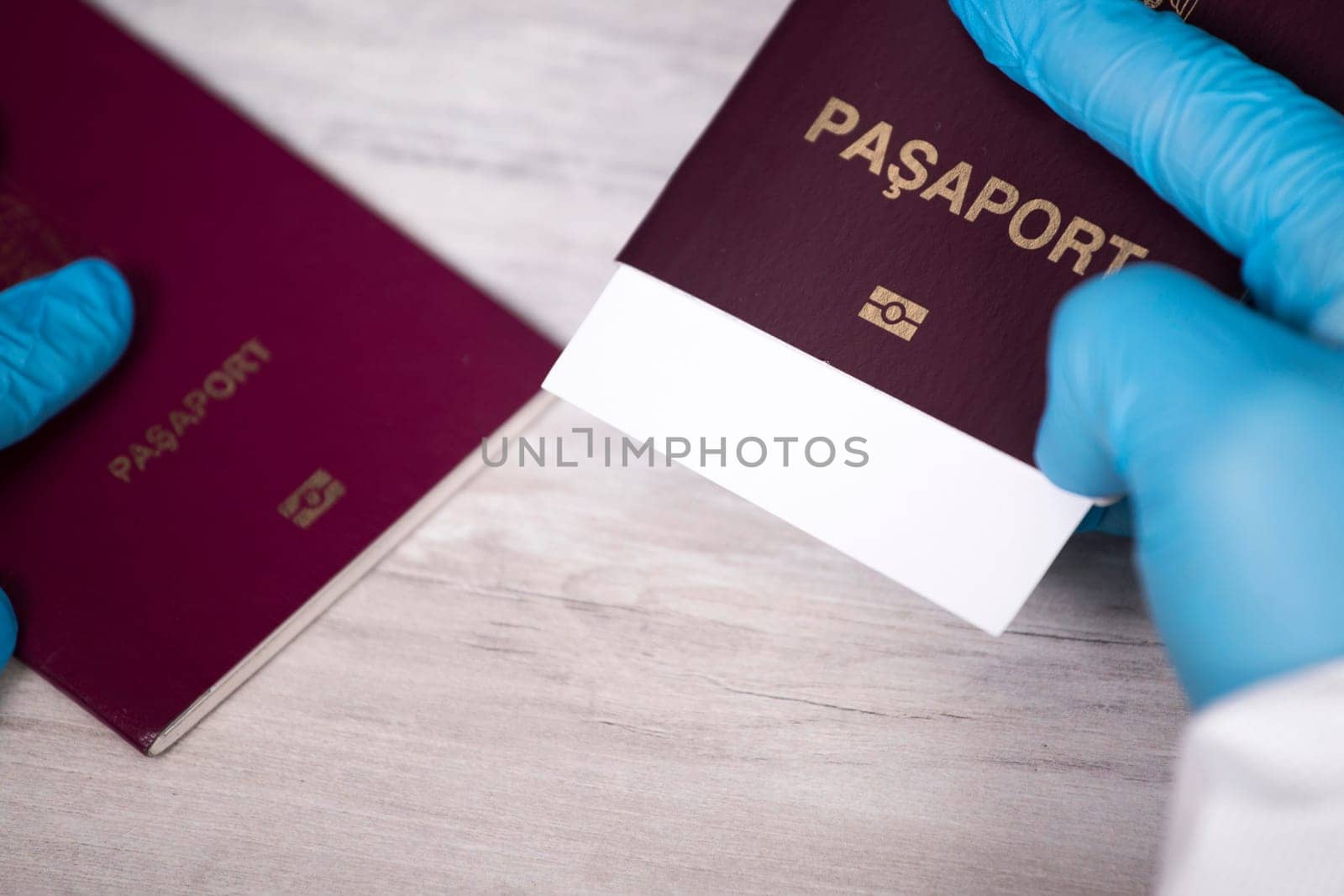 Doctor holding passport.  Immunity passport, risk-free certificate concept.