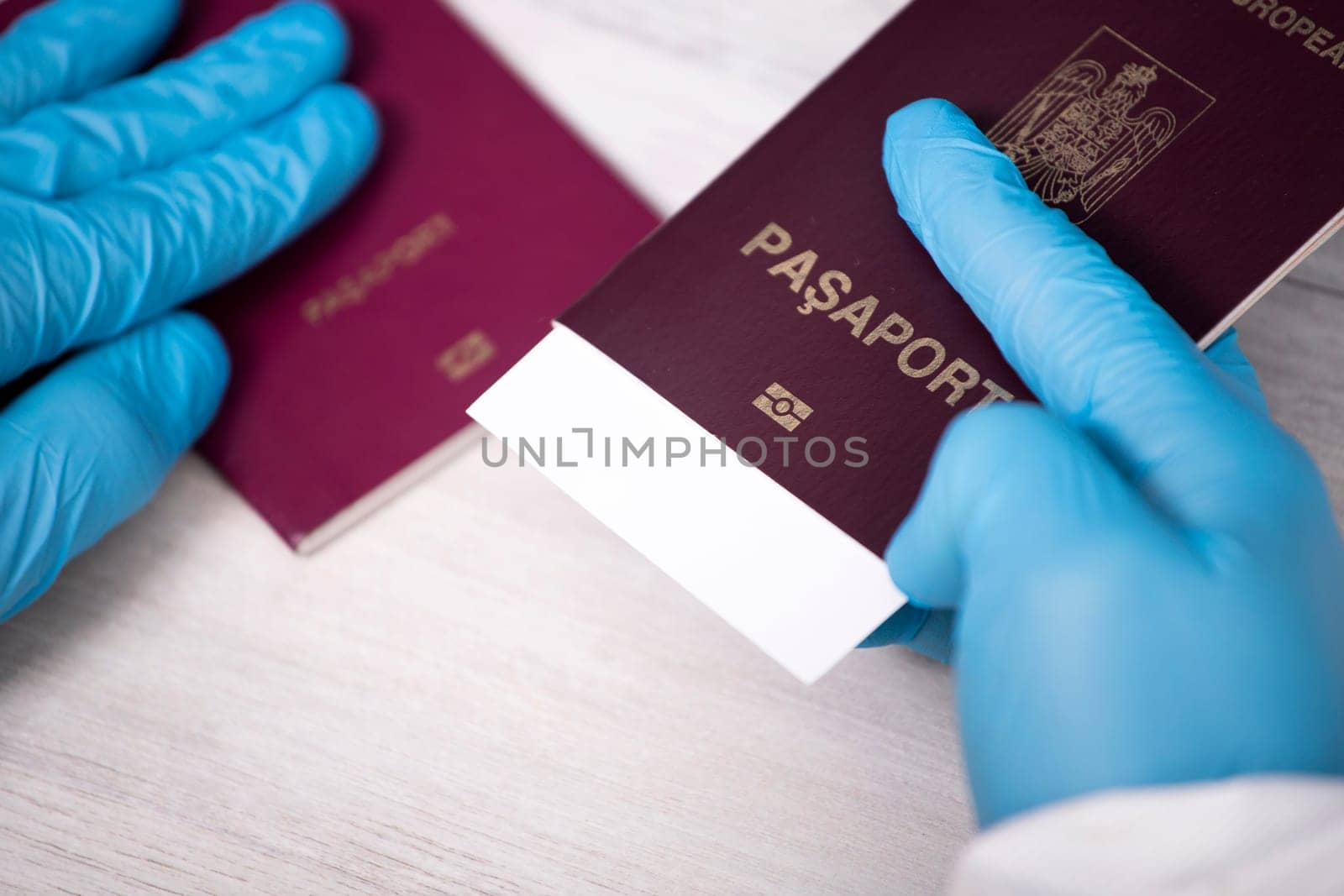 Doctor holding passport and negative covid-19 ( rapid antigen SARS-CoV-2 Ag ) test. Coronavirus and safety travel concept.