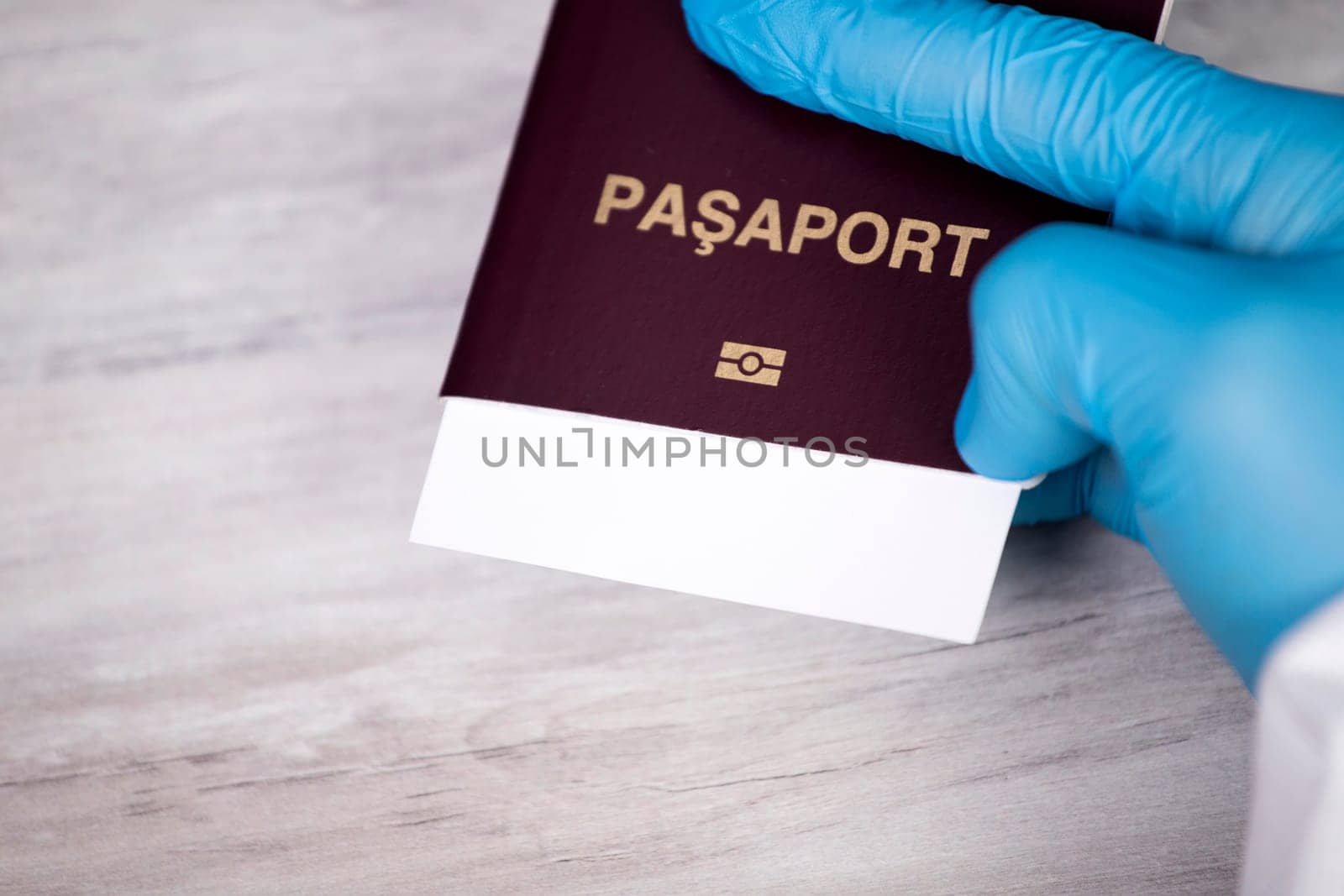 Doctor holding passport.  Immunity passport, risk-free certificate concept.