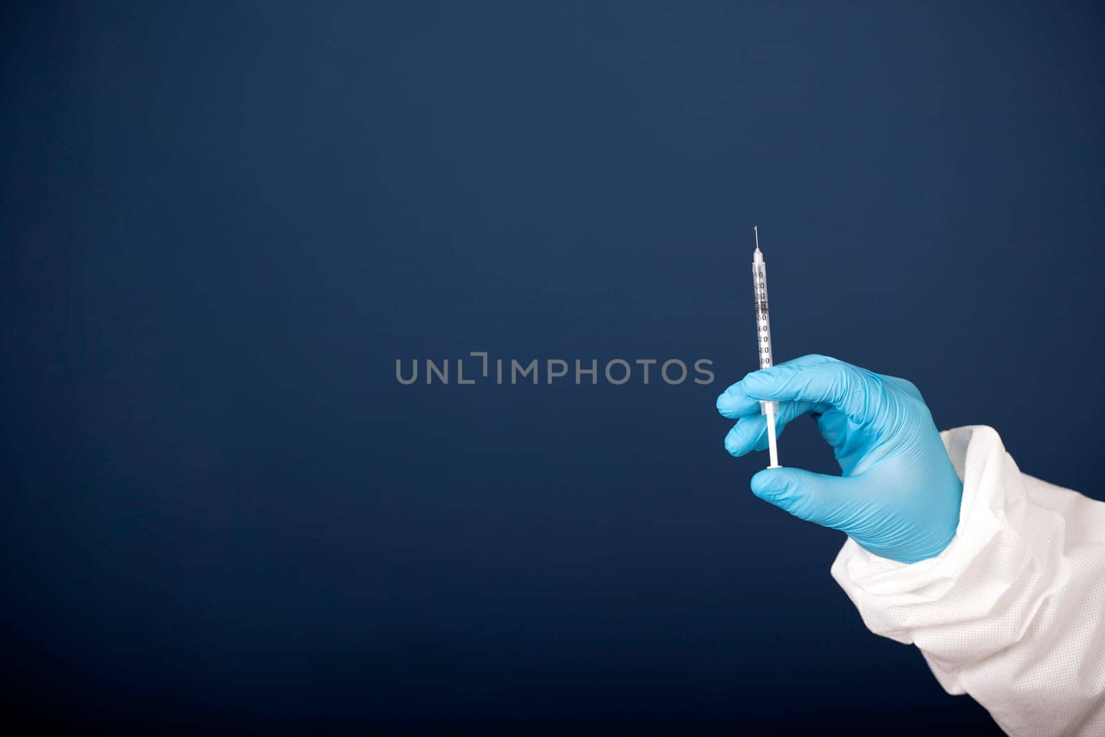 Concept of herd immunity, virus spreading in society. Doctor with syringe is preparing for vaccine.