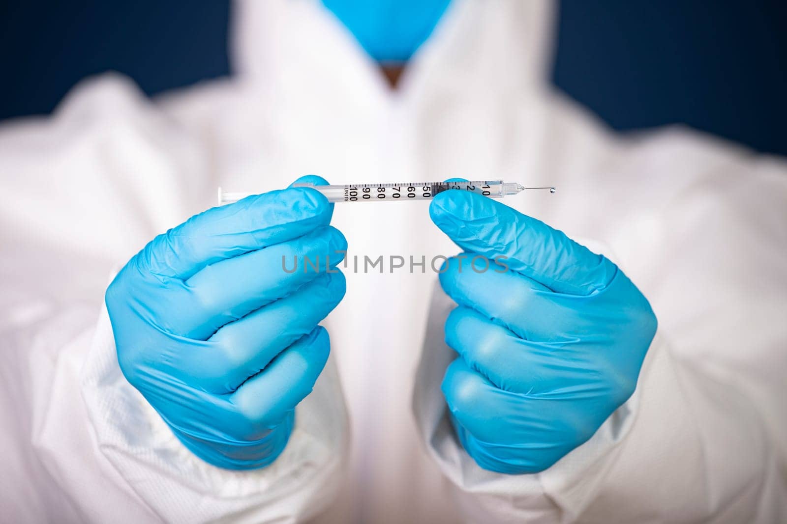 Concept of herd immunity, virus spreading in society. Doctor with syringe is preparing for vaccine.