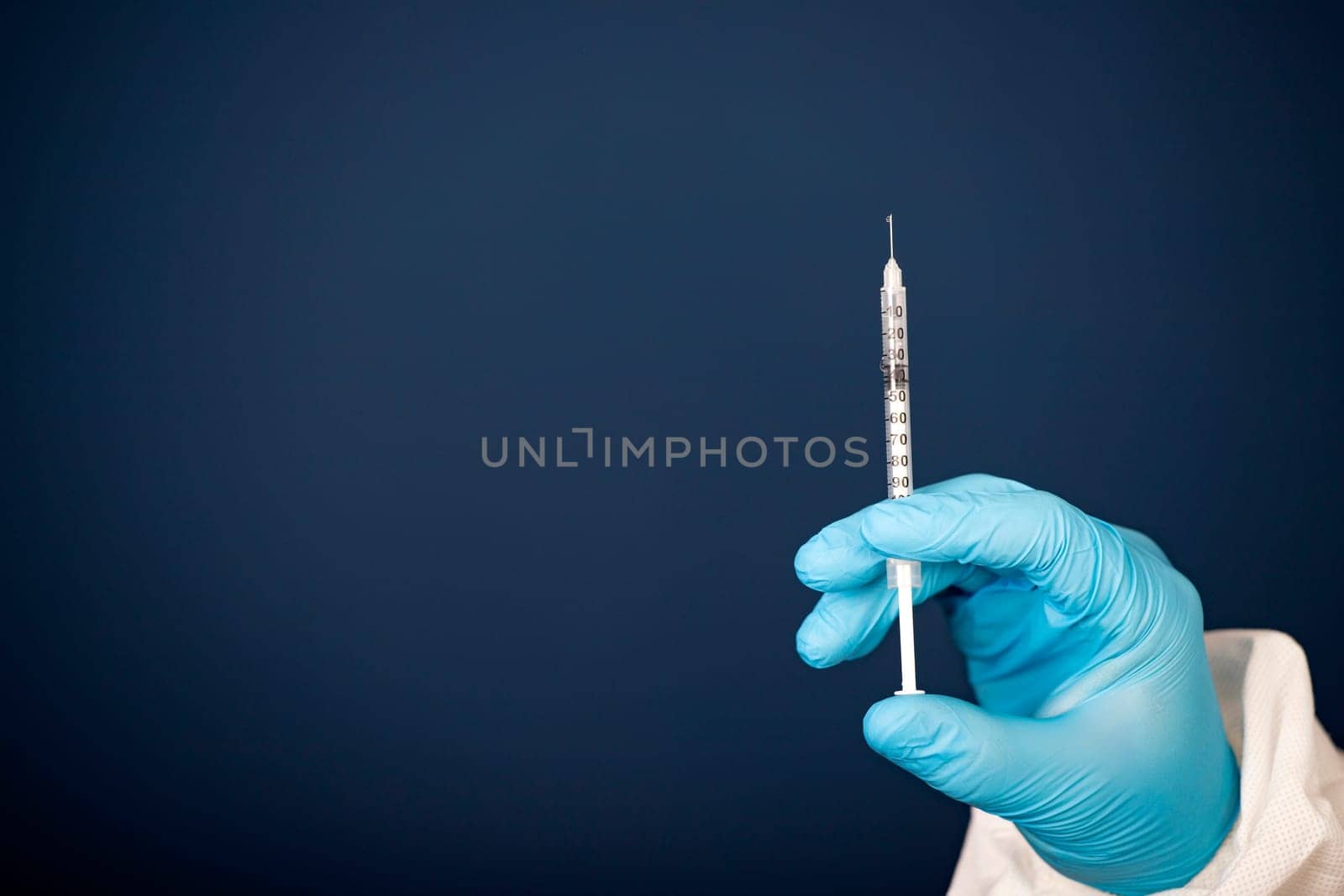 Concept of herd immunity, virus spreading in society. Doctor with syringe is preparing for vaccine.
