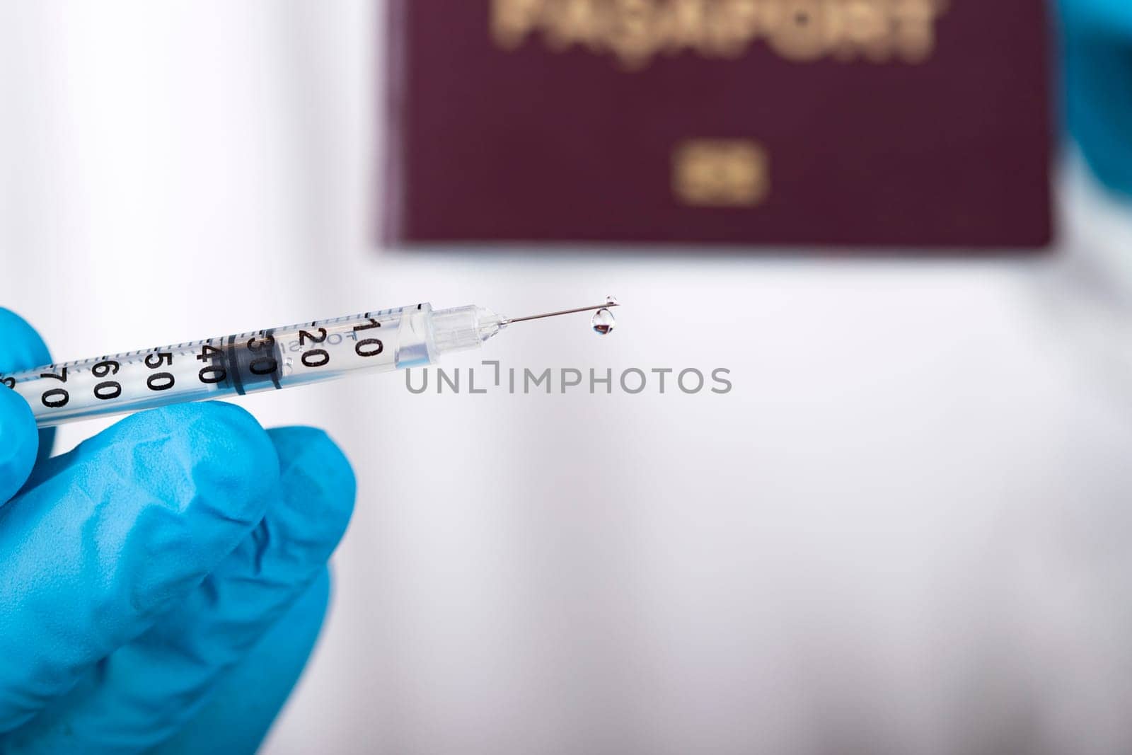 Doctor holding passport and vaccine. Immunity passport, risk-free certificate concept.