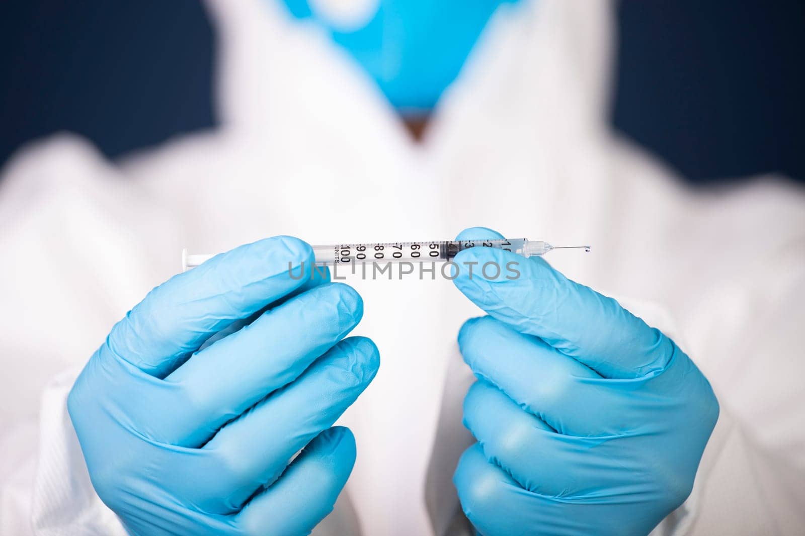 Concept of herd immunity, virus spreading in society. Doctor with syringe is preparing for vaccine.