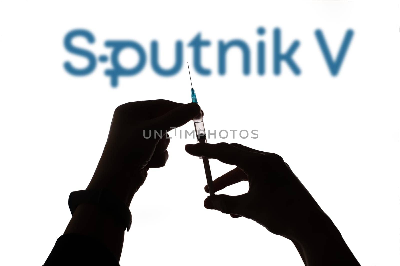 Cluj-Napoca, Romania - March 15, 2021:  New coronavirus vaccine Sputnik V concept, blurred Sputnik V logo on the background. Covid-19, 2019-nCov pandemic.